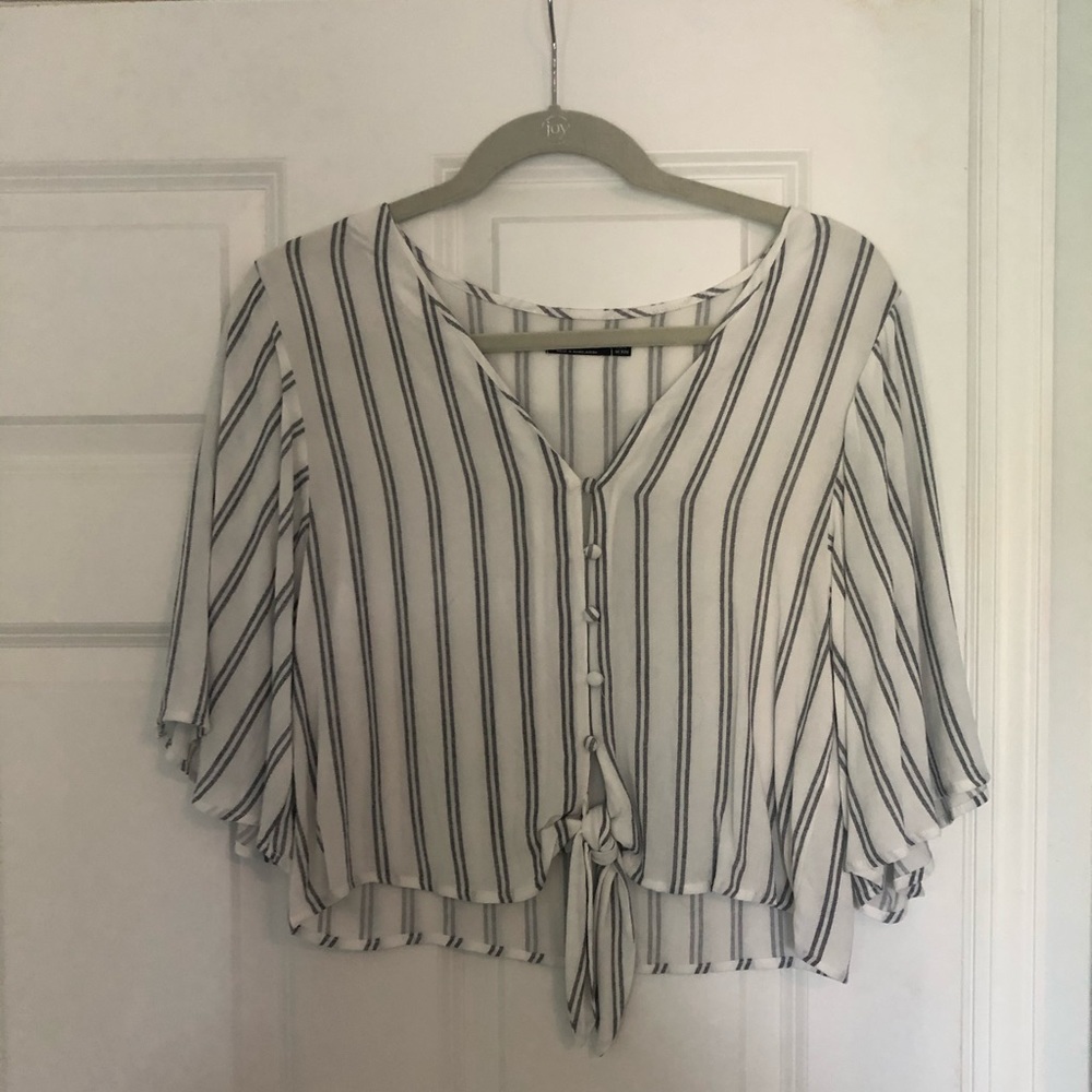 Button up shirt with tie at the bottom